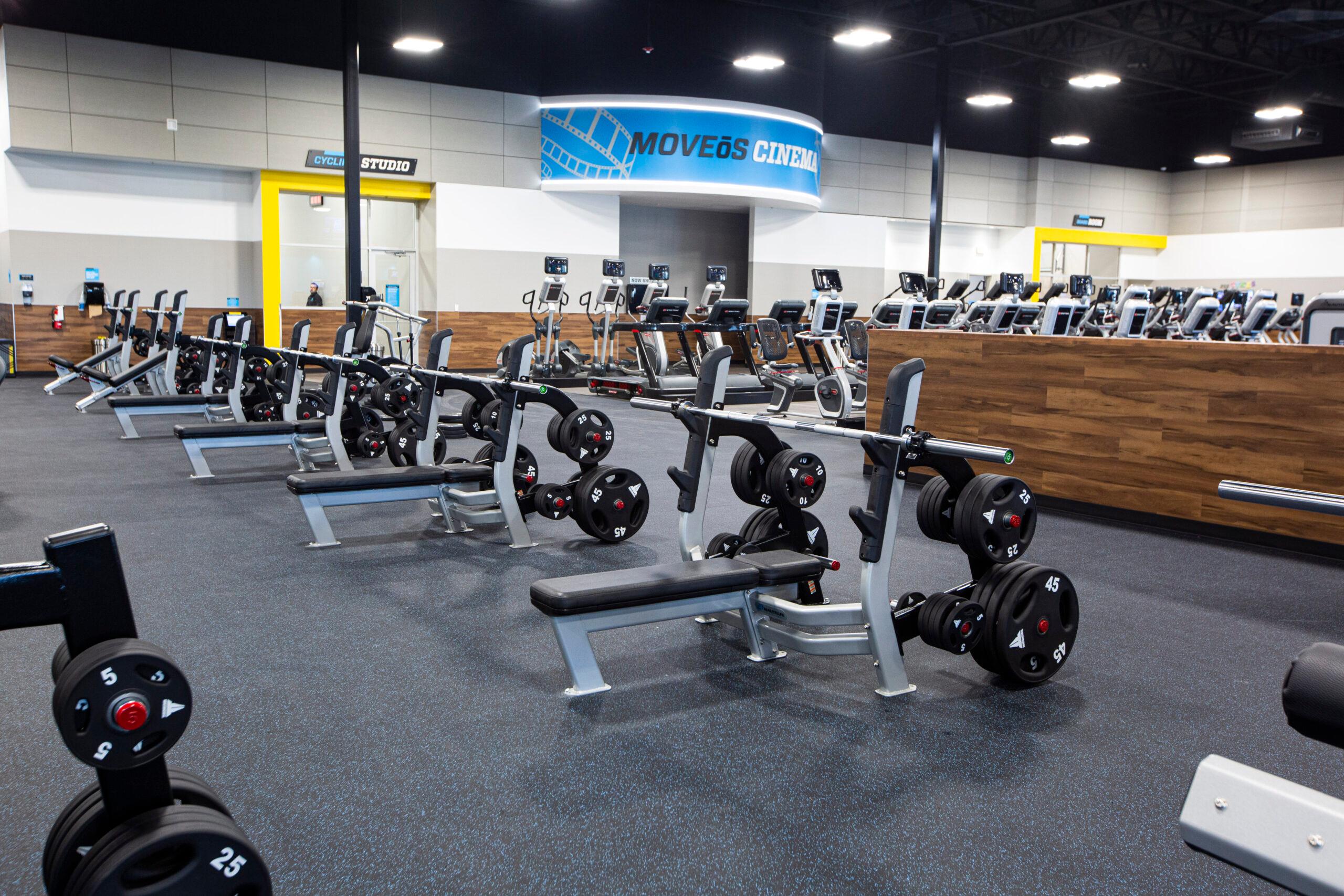 EoS gym with bench press stations and cardio equipment in the background