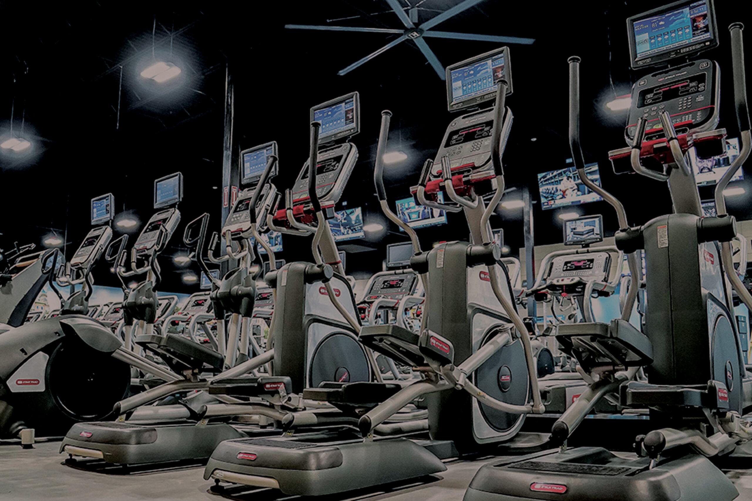 row of modern cardio equipment in the middle of a eos branded