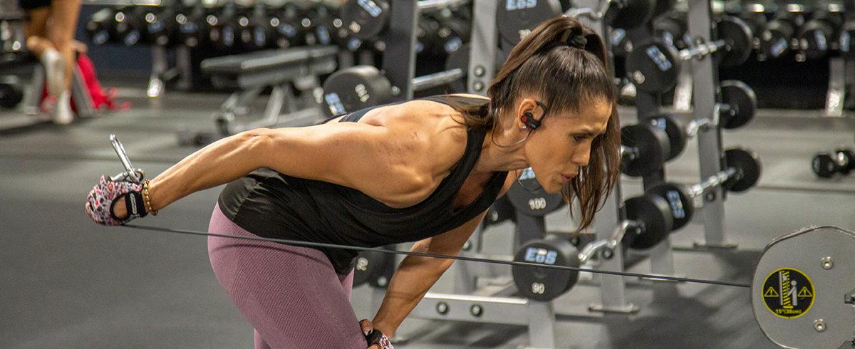 athletic eos gym member working out on cable machine