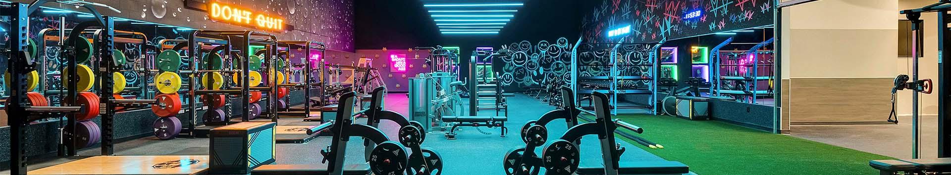 vibrant wide shot showing multiple eos gym members and fitness equipment