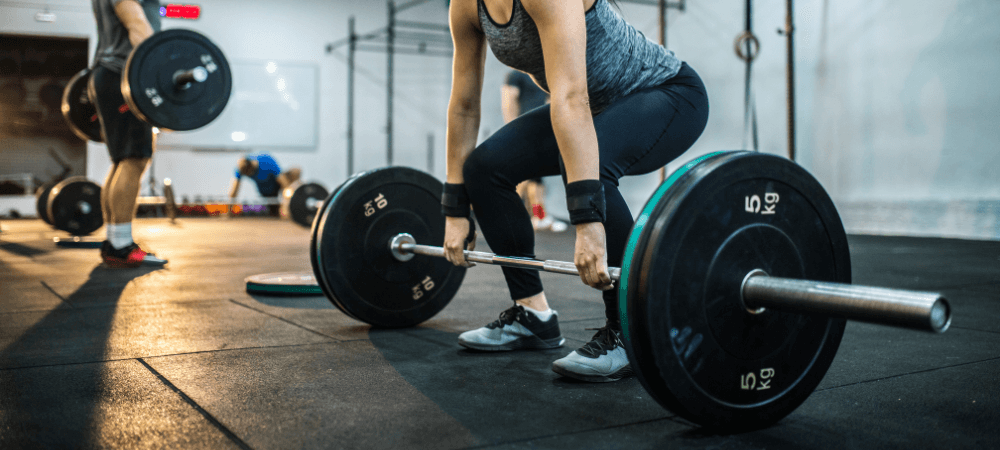 athletic eos gym members deadlifting with modern equipment