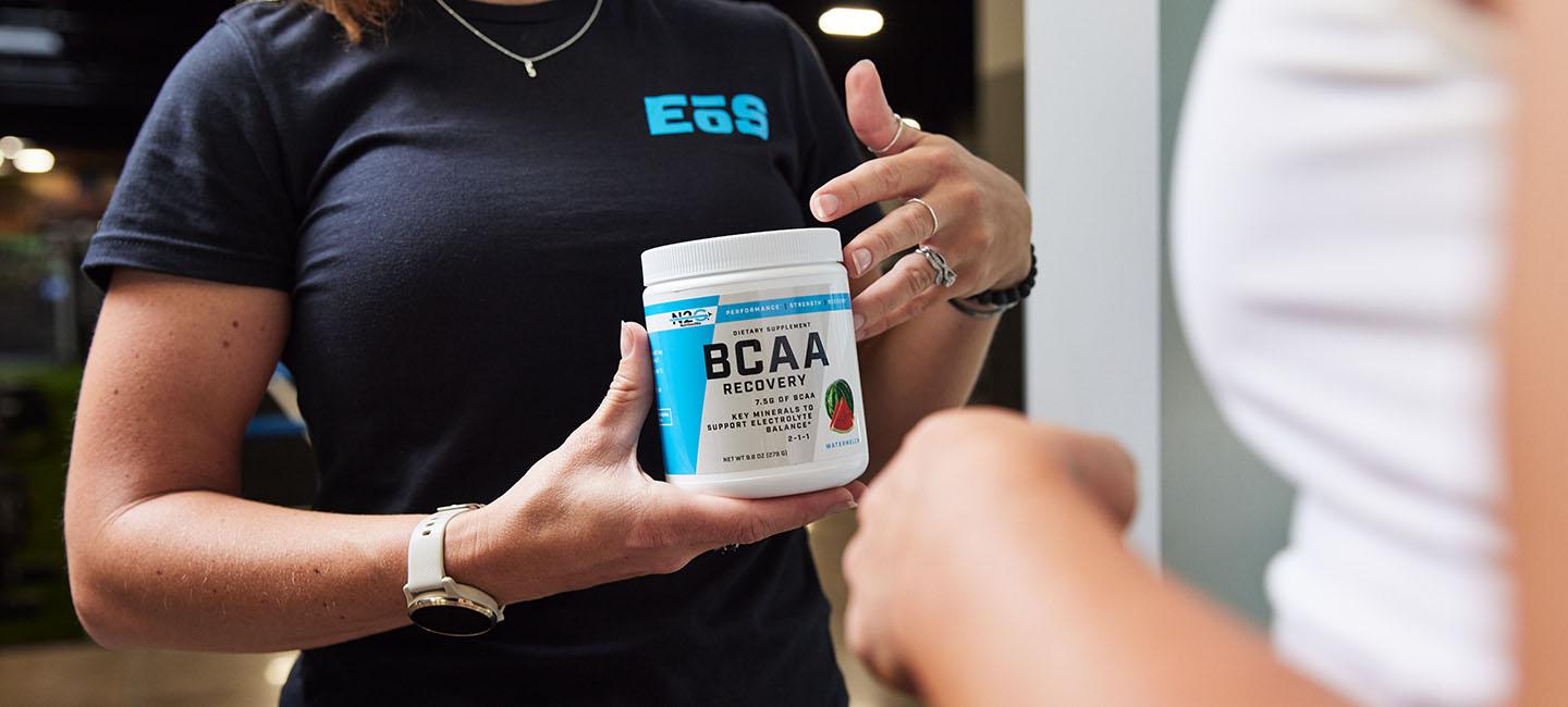 eos staff explaining the benefits of bcaas to gym member