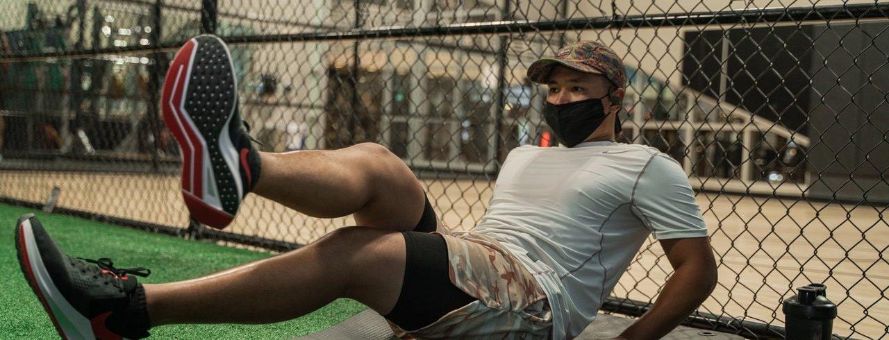 man working out with mask safely