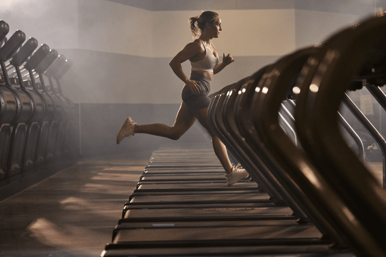 athletic eos gym member running on a treadmill 