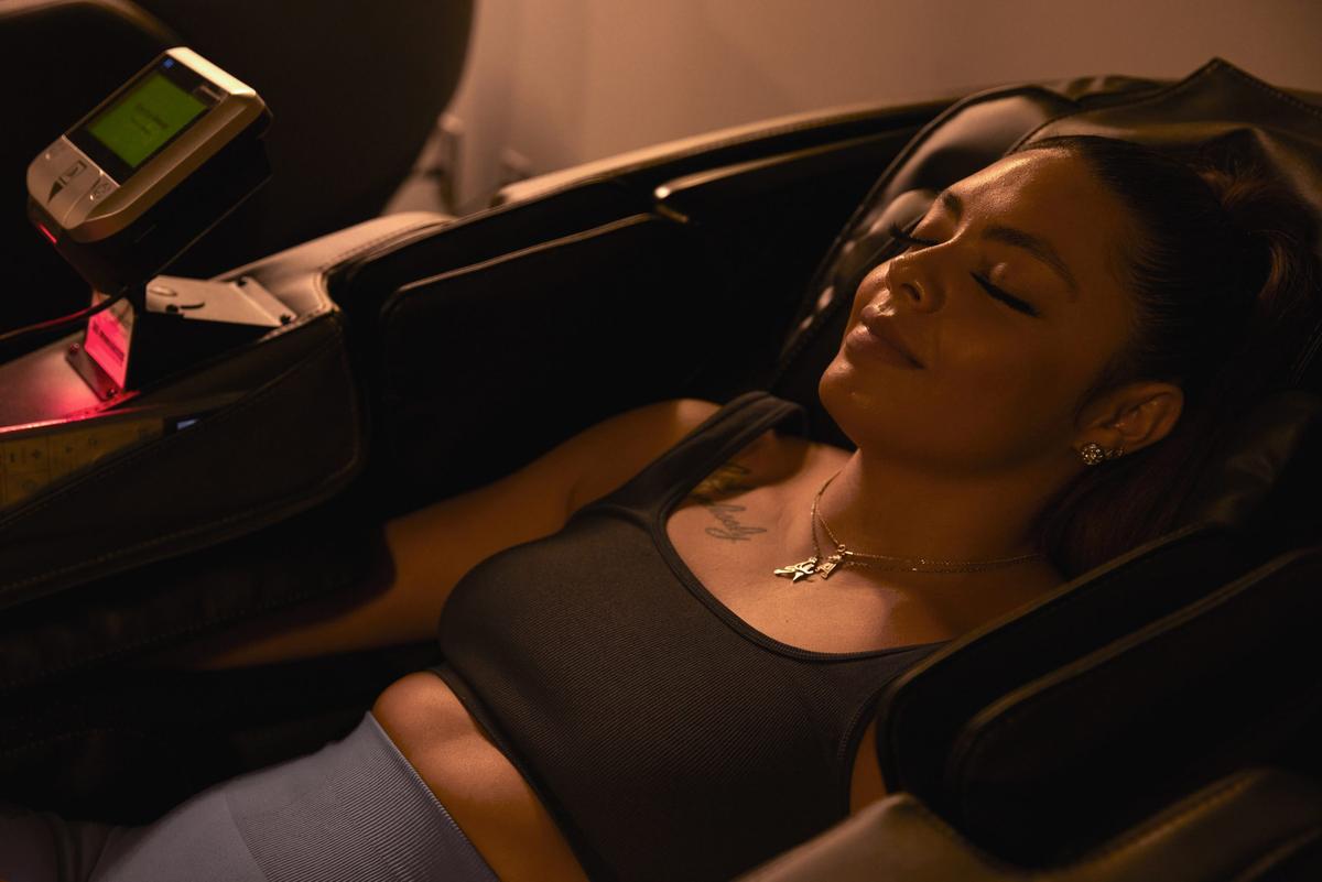 eos gym member recovering in massage chair