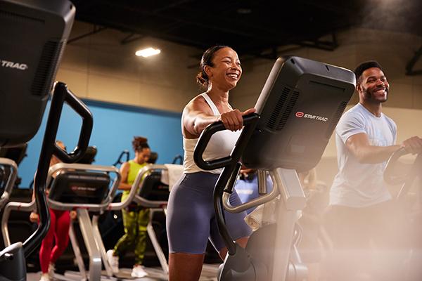 eos gym member working out on an elliptical 