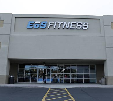 outside shot of a modern eos gym with brick walls and bright blue branding