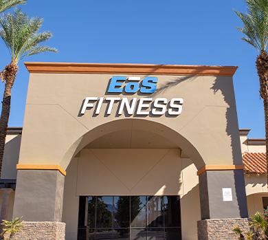 outside shot of a modern eos gym with brick walls and bright blue branding