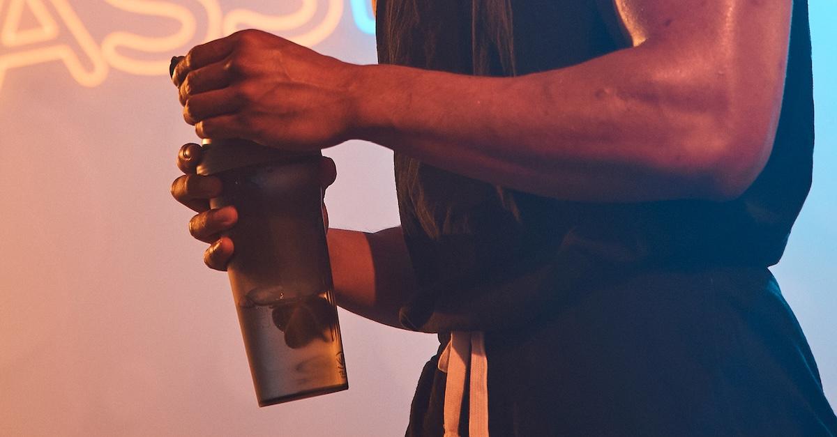 eos gym member drinking water while in a bbl class