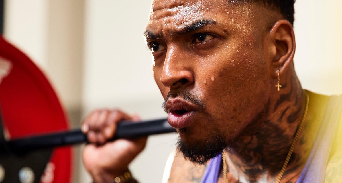 powerlifter doing squat at an eos gym