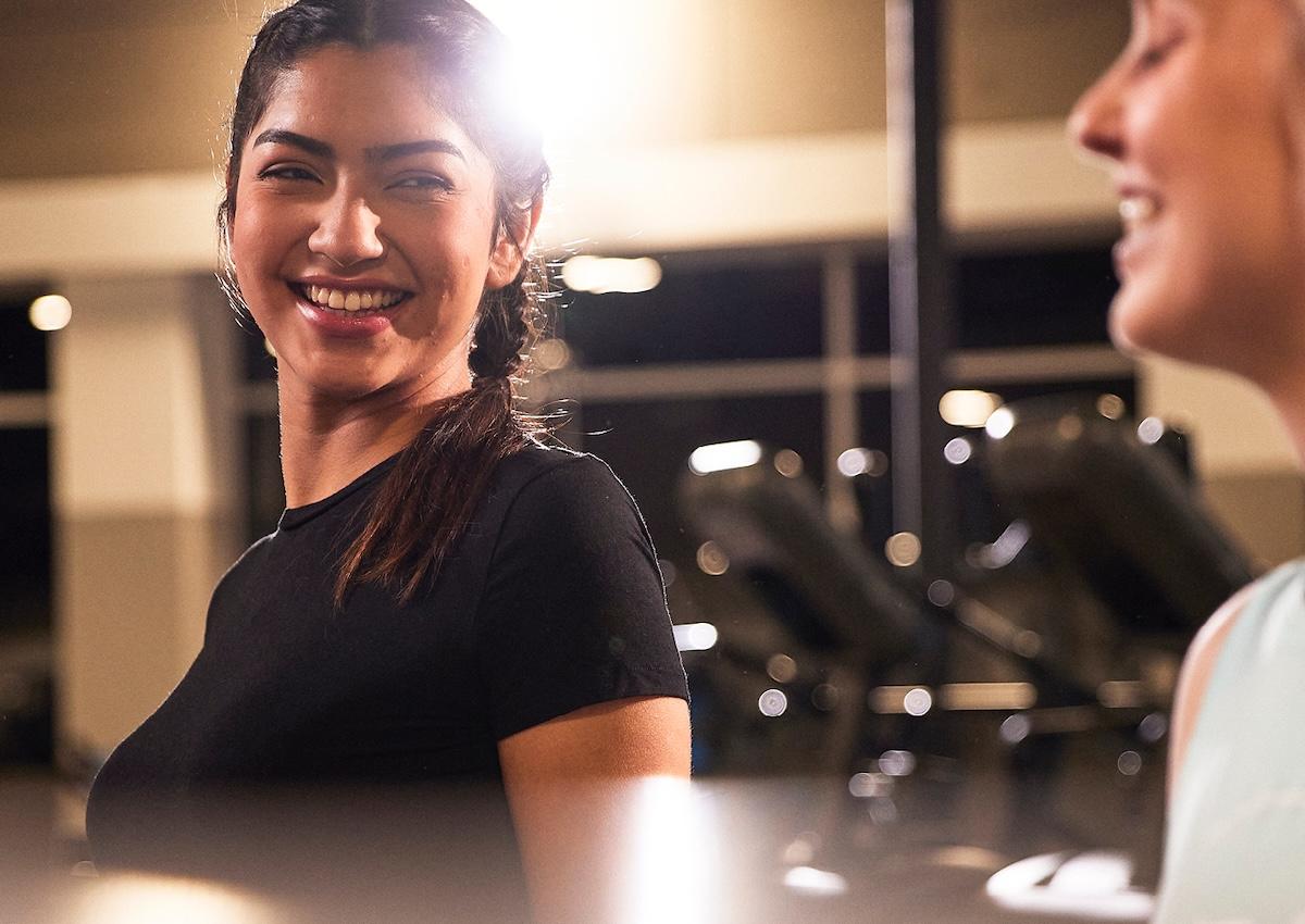 two eos gym members reducing their stress together by exercising at an eos gym in phoenix Arizona