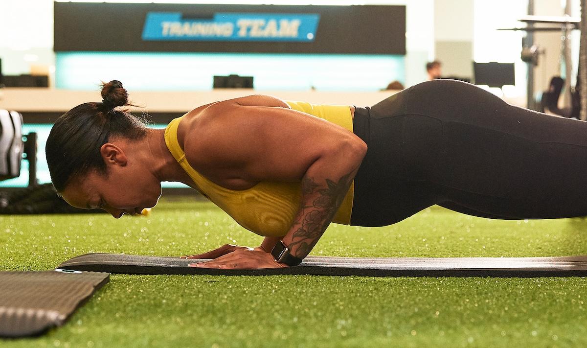 eos gym member doing blanks on indoor turf