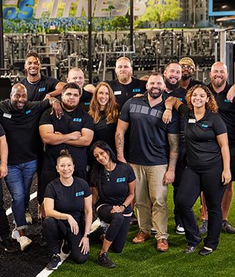 a group photo of several different members of eos staff standing and smiling