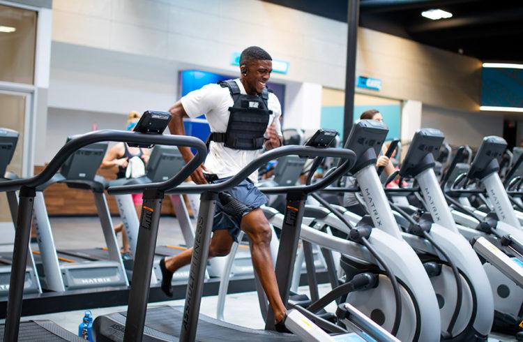 athletic eos gym member race training on a treadmill