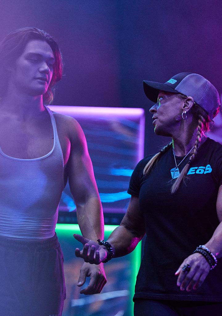 eos influencer and personal trainer standing in a brightly lit room with eos branding