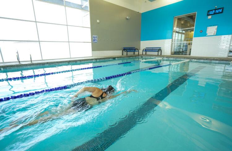 eos member swimming in a clean eos branded lap pool