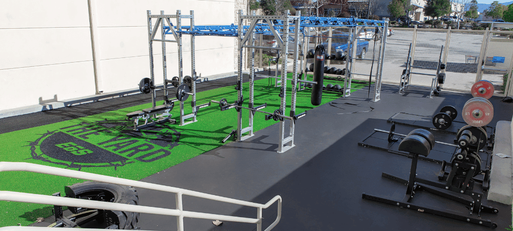 outdoor shot of a fully equipped outdoor gym with eos branding