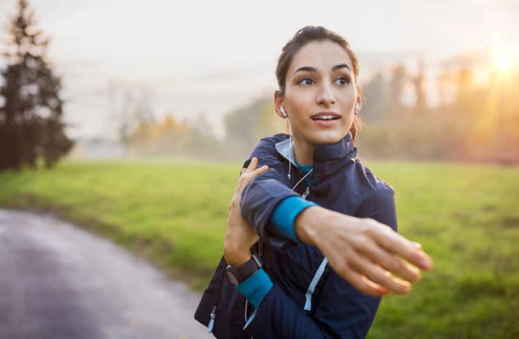 athletic person performing Morning Stretches outside