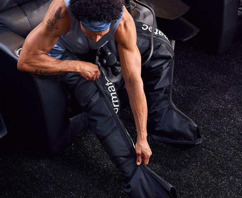 eos gym member opening a compression boot