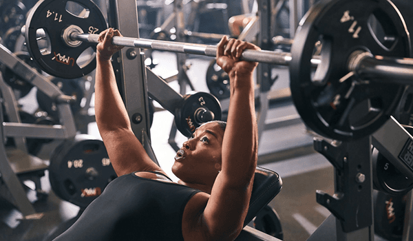 eos gym member bench pressing