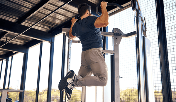 eos gym member doing pull ups