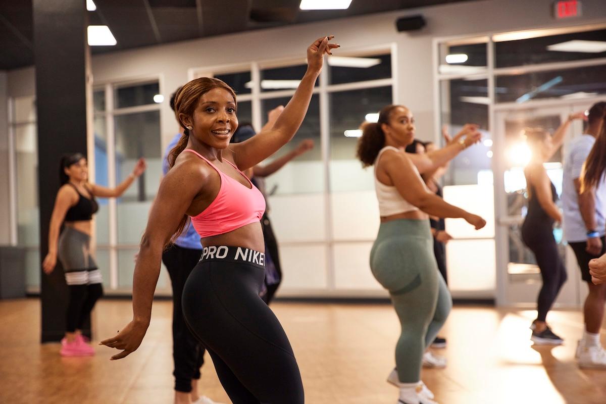group of athletic eos gym members dancing in a class