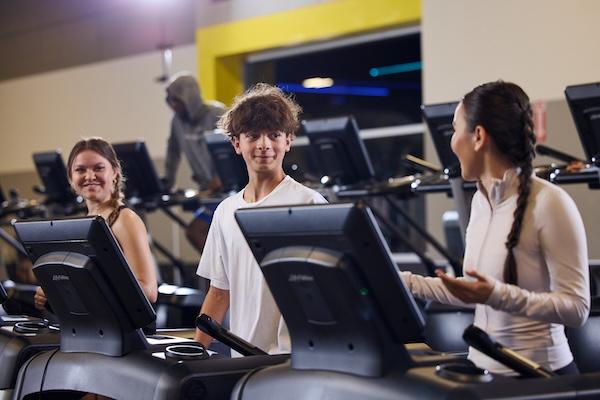 eos gym member teens doing cardio together