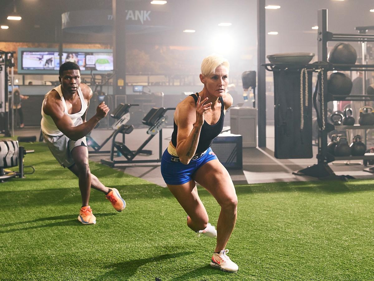 eos gym members doing cardio on indoor turf