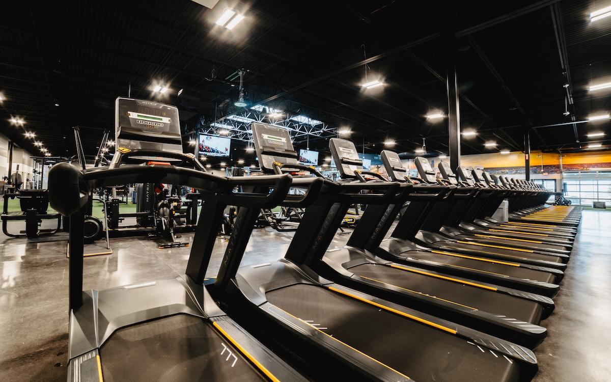 a row of modern treadmills at eos fitness