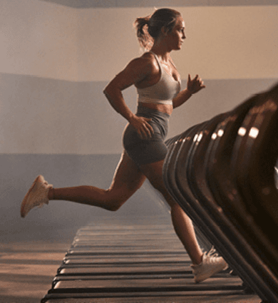 eos fitness member running on the treadmill