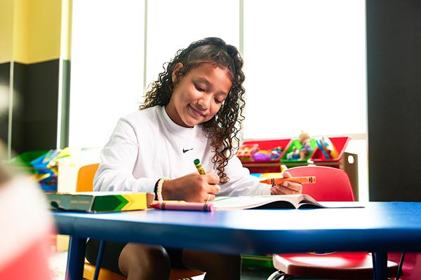 Child playing in the EōS Kids’ Club daycare