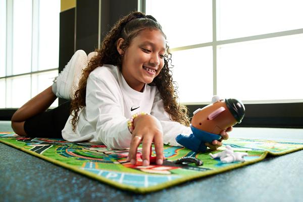 Child playing in the EōS Kids’ Club