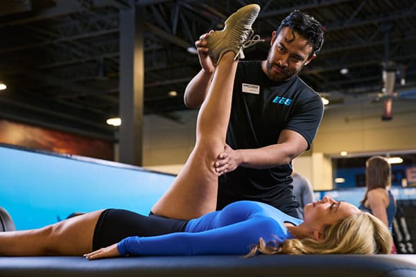 eos myofascial technician doing assisted stretch with eos memeber