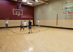gym with indoor basketball court