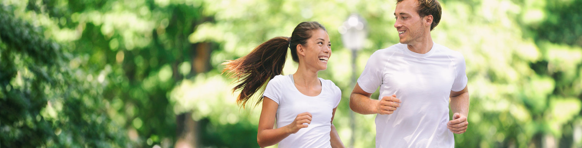 man and women running outside to help reduce stress