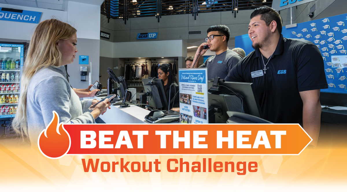 woman checking in to front desk with BEAT THE HEAT WORKOUT CHALLENGE text
